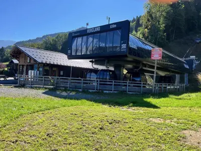 a large building with a house on top of it at Chalet chaleureux au pied des pistes avec animaux acceptés - FR-1-624-184 in Samoëns