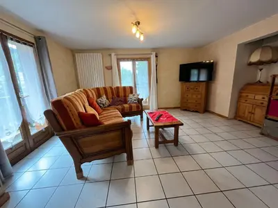 a living room with a couch and a coffee table at Chalet chaleureux au pied des pistes avec animaux acceptés - FR-1-624-184 in Samoëns