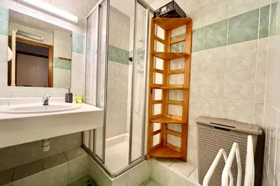 a bathroom with a sink and a shower at Cœur Combloran in Combloux