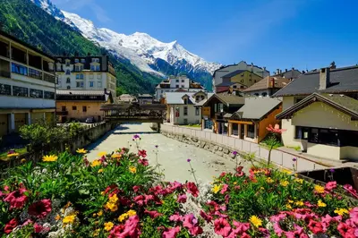 a ski lodge with benches in the snow at Appartement Les Capucins jardin - Happy Rentals in Chamonix-Mont-Blanc