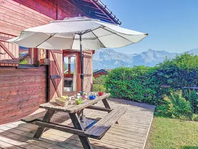 an old wooden house sitting on top of a hill at Holiday Home Les Chalets de La Combe by Interhome in Mémontel
