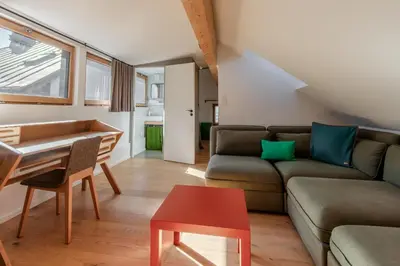 a living room with a couch and a table at Le Nevada - Duplex T4 Proche Centre in Chamonix-Mont-Blanc