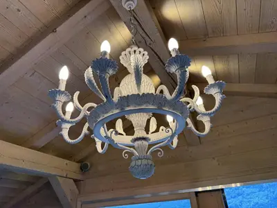 a chandelier hanging from the ceiling of a house at Le Chalet MontBlanc in Bionnay