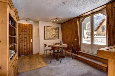 a bedroom with two bunk beds and a desk at Hyper central apartment with rooftop in Chamonix-Mont-Blanc