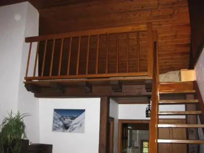 a wooden staircase in a room with a stair case at Appartement Léa in Chamonix-Mont-Blanc