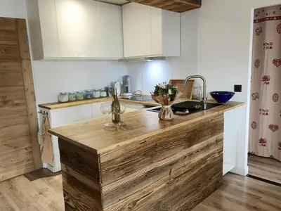 a kitchen with a wooden counter top in a room at 3 PIECES résidence LA POINTE PERCEE - FR-1-572-207 in Arâches-la-Frasse