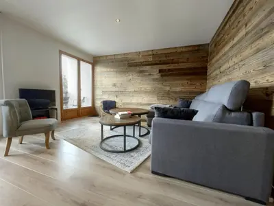 a living room with a couch and a table at 3 PIECES résidence LA POINTE PERCEE - FR-1-572-207 in Arâches-la-Frasse