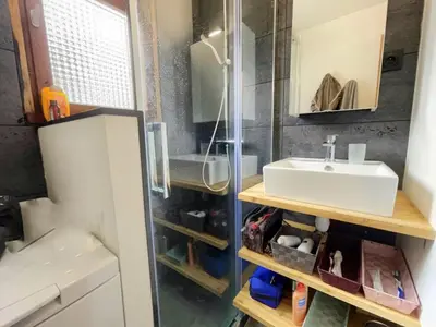 a small bathroom with a sink and a mirror at 3 PIECES résidence LA POINTE PERCEE - FR-1-572-207 in Arâches-la-Frasse