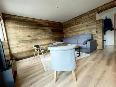 a living room with a couch and a table at 3 PIECES résidence LA POINTE PERCEE - FR-1-572-207 in Arâches-la-Frasse