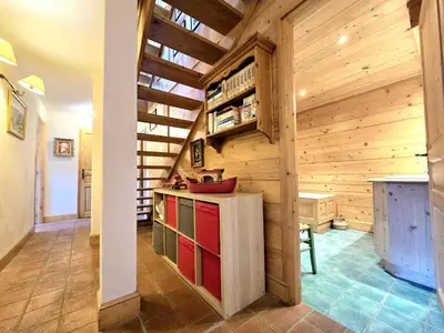 a kitchen with wooden walls and a ceiling at Chalet near centre of Megève in Megève