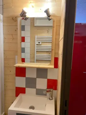 a bathroom with a mirror and a sink at Studio Samoens 1600 pied des pistes in Samoëns