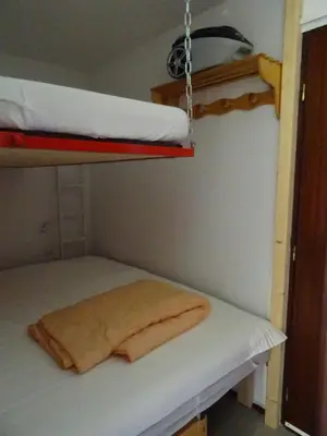 a room with two bunk beds and a hanging bed at Studio Samoens 1600 pied des pistes in Samoëns