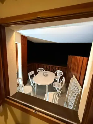 a view of a table and chairs from a window at Appartement Samoens Cosy in Samoëns