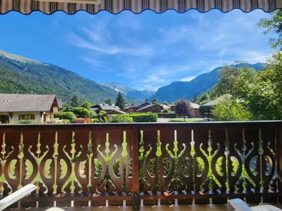 a balcony with a view of mountains at T3 calme à Samoëns, proche centre, WIFI, parking privé - FR-1-629-150 in Samoëns