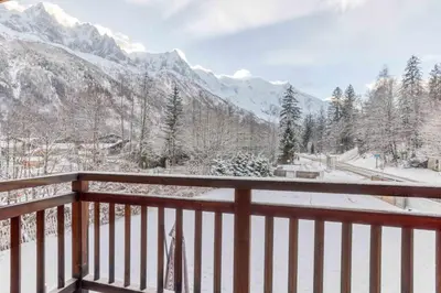 a balcony with a view of a snow covered mountain at Luxurious Chalet Verney - 8 people in Chamonix-Mont-Blanc