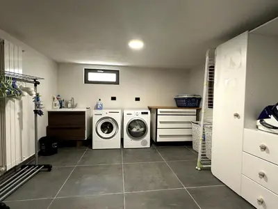 a laundry room with a washer and dryer in it at Luxurious Chalet Verney - 8 people in Chamonix-Mont-Blanc
