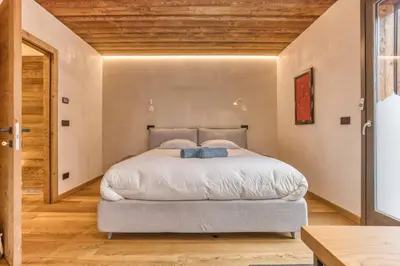 a bedroom with a bed and a wooden ceiling at Luxurious Chalet Verney - 8 people in Chamonix-Mont-Blanc