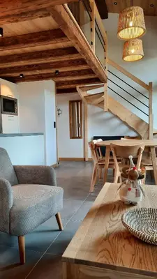 a living room with a couch and a table at NEW - Le Splendid' - Duplex standing rénové 6-8 pers in Arâches-la-Frasse