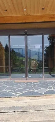 a building with a lot of windows on the ground at AP-37 La Grande Cordée Combloux in Combloux