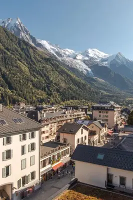 an aerial view of a town with mountains in the background at Appt Cosy - Vue Mont-Blanc en hyper centre in Chamonix-Mont-Blanc