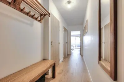 a hallway with a wooden bench in a house at Mountain Lodge 204 - 90m2 - à côté du télésiège in Saint-Gervais-les-Bains