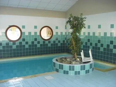 a bathroom with a tub with a tree in it at APPARTEMENT 6 Personnes SAMOENS in Samoëns