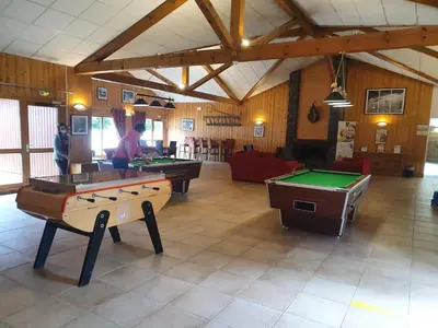 a large room with several pool tables in it at APPARTEMENT 6 Personnes SAMOENS in Samoëns