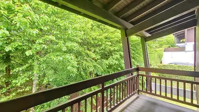 a porch with a view of a tree at 1 Gentil Homme in Megève