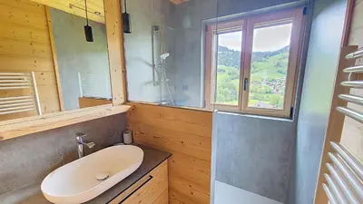 a bathroom with a sink and a window at 1 Gentil Homme in Megève
