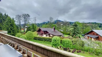a house sitting on top of a fence at 1 Clos des Mourets C2 in Megève