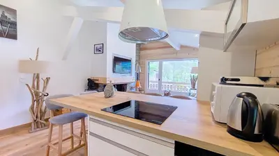 a kitchen with a counter top with a microwave at 1 Clos des Mourets C2 in Megève