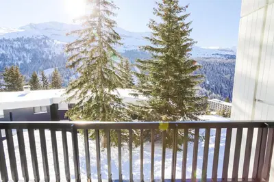 a balcony with two christmas trees in the snow at Résidence Capricorne - maeva Home - Studio 4 Personnes - Budget MAE-3836 in Flaine