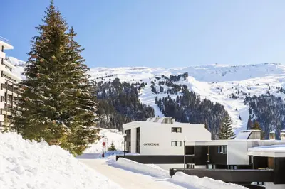 a building with a christmas tree in the snow at Résidence Capricorne - maeva Home - Studio 4 Personnes - Budget MAE-3836 in Flaine