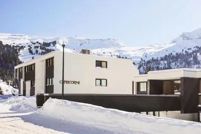 a building in the snow in front of a mountain at Résidence Capricorne - maeva Home - Studio 4 Personnes - Budget MAE-3836 in Flaine