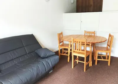 a living room with a couch and a table and chairs at Résidence Capricorne - maeva Home - Studio 4 Personnes - Budget MAE-3836 in Flaine