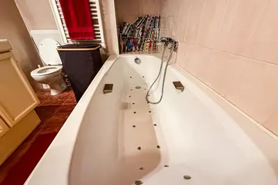 a bathroom with a sink and a bath tub at Stay in the heart of Chamonix-Mont-Blanc in Chamonix-Mont-Blanc