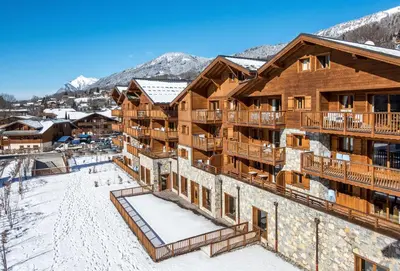 an aerial view of a lodge in the snow at CGH Résidence Boutique Les Chalets De Laÿssia in Samoëns
