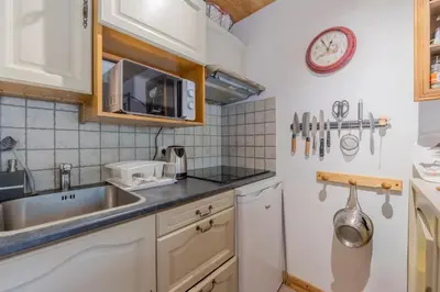 a bathroom with a tub and a sink and a shower at Clos Du Savoy - South Facing Balcony - Happy Rentals in Chamonix-Mont-Blanc