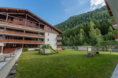 a hotel in the mountains with snow on the ground at l'Ours Bleu B13 - Ski In Ski Out in Vallorcine