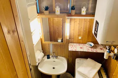 a small bathroom with a sink and a toilet at Alpine stay right in the center of Chamonix in Chamonix-Mont-Blanc
