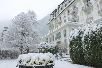 a large white building with two balconies on it at Alpine stay right in the center of Chamonix in Chamonix-Mont-Blanc