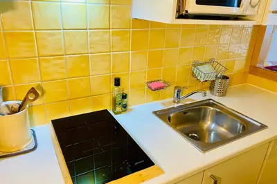 a kitchen with a sink and a counter top at Alpine stay right in the center of Chamonix in Chamonix-Mont-Blanc