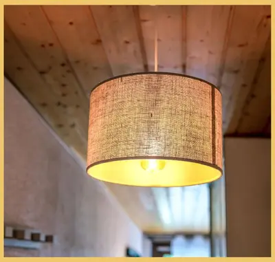 a lamp hanging from the ceiling of a room at L'Aiguille de Chamonix I Appartement Les Praz in Chamonix-Mont-Blanc