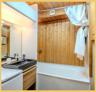 a bathroom with a sink and a mirror at L'Aiguille de Chamonix I Appartement Les Praz in Chamonix-Mont-Blanc