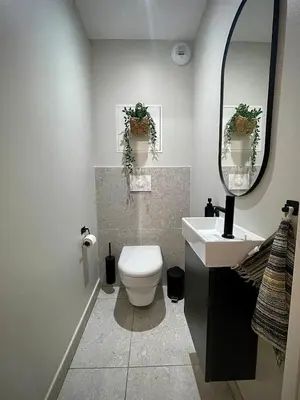 a bathroom with a toilet and a sink and a mirror at Elba, Les Mazots de Kayla in Les Houches