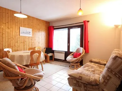 a living room with a table and chairs at 3 Pièces aux Carroz, 6 Pers, Terrasse, Parking - FR-1-572-338 in Arâches-la-Frasse