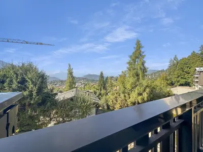 a view from the balcony of a house with trees at BA229 - 2 pieces mezzanine 6 pers pied de pistes in Les Carroz d'Araches