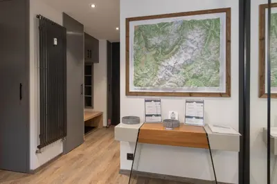 a room with a map on the wall and a desk at Quartz - Appt 4 etoiles vue Mont-Blanc - Centre in Chamonix-Mont-Blanc
