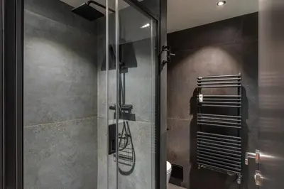 a shower with a glass door in a bathroom at Quartz - Appt 4 etoiles vue Mont-Blanc - Centre in Chamonix-Mont-Blanc