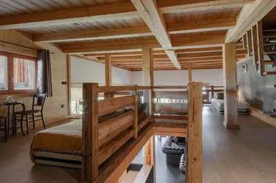 a room with a bunk bed in a cabin at Appt Vincent - 200 m2 - Ideal famille - Vue Mont-B in Cordon